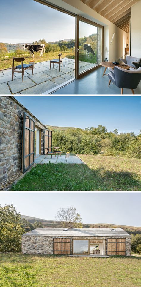 This contemporary stone cottage has a small patio with expansive views of the mountains and valleys in the distance. #StoneCottage #ContemporaryCottage Stone Cottages, Stone Facade, Contemporary Cottage, Stone Cottage, Exterior Stone, Patio Stones, Stone Houses, Stone House, Light Wood