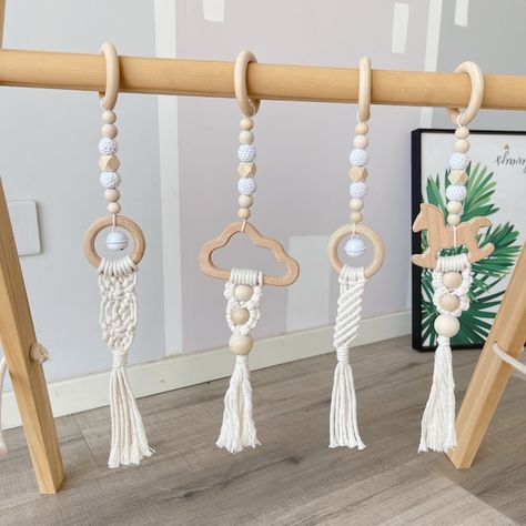 View Play Gym Toys by HandcraftedFairyland on Etsy Baby Hanging Toys, Play Gym Toys, Natural Baby Toys, Baby Tummy Time, Wooden Baby Gym, Perfect Photography, Baby Gym Toys, Macrame Baby, Baby Play Gym