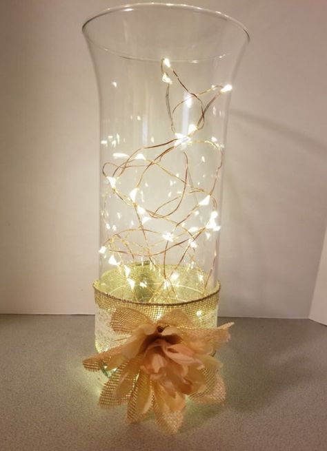 Tall Cylinder Vase Ideas, Vases Fairy Lights, Cylinder Vase With Fairy Lights, Tall Glass Vase Centerpiece With Lights, Cylinder Vase Centerpiece Wedding, Fairy Lights Wrapped Around Vase, Cylinder Vase Centerpiece Wedding Fairy Lights, Cylinder Vase Centerpiece, Cylinder Vase Ideas