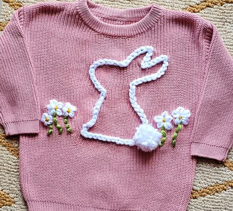 Our adorable "Easter Bunny" sweaters are perfect for Easter, Birthdays, family pictures, and perfect for cooler weather!! We offer various sizes so that siblings can match as well!! Your sweater will feature the Bunny and Flower hand embroidery as pictured unless you specify different. If you would like to add an additional design to your sweater, please use the "Add a Design option before checking out. Embroidered Baby Clothes, Easter Sweater, Easter Sweaters, Bunny Sweater, Flower Hand Embroidery, Bunny Embroidery, Custom Sweaters, Custom Baby Gifts, Easter Embroidery