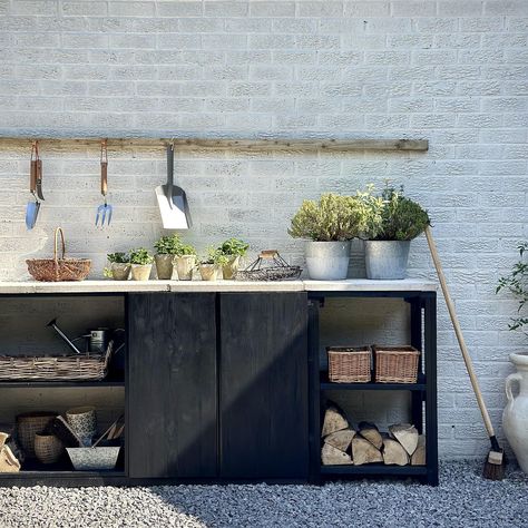 This garden potting station was created using old cabinets from eBay | Ideal Home Garden Potting Station, Gardening Forks, Planting Bench, Exterior Wood Paint, Potting Bench Ideas, Potting Station, Outdoor Potting Bench, Garden Station, Stone Plant