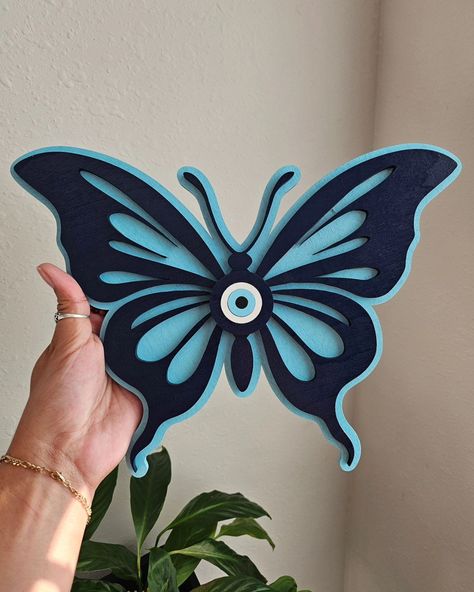 Jessica turned her favorite rug design into wall decor 😍 Evil Eye Butterflies are now available on our website and Etsy. Order yours today! #evileyewalldecor #butterfly #butterflywalldecor #spirituality Evil Eye Butterfly, Eye Butterfly, Butterfly Wall Decor, Butterfly Wall Art, Butterfly Wall, Wedding Basket, Rug Design, Wall Hangings, Evil Eye