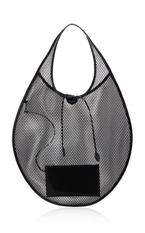 Find ALAÏA Leather-trimmed Mesh Tote Bag Os on Editorialist. The ALAÏA Leather-Trimmed Mesh Tote Bag is crafted from laser-cut mesh and trimmed with leather. This tote has a semi-sheer body fashioned into a circular silhouette. It features a top handle and a tie detail. Mesh Pouch Bag, Tote Bag Packaging, Ethereal Dramatic, Alaia Bag, Creative Tote Bag, Edgy Bags, Totes Ideas, Statement Bags, Azzedine Alaïa