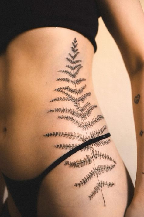 Blue Fern Tattoo, White Rib Tattoo, Nature Tattoo Inspiration, Nature Tattoos Shoulder, Thigh Fern Tattoo, Where The Red Fern Grows Tattoo, Lower Rib Tattoos For Women, Mullein Tattoo, Aquatic Plant Tattoo