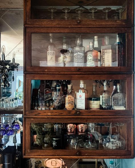 Kitchen & Bar Photo Dump ⬇️ . Someday I’m going to have a better photographer in here to show me how to photograph a space with a mirrored backsplash. . It’s SO cool. . And of course it would have been easier to use regular cabinetry for the bar: but the antique barrister bookcases are WAY cooler (yes, they were ridiculously reinforced and over engineered by my favorite over-engineered). . These are random corners of the kitchen. . What do you have questions about? Mirrored Backsplash, Bookcase Ideas, Barrister Bookcase, Mirror Backsplash, How To Photograph, Bar Cabinet, Best Photographers, So Cool, The Bar