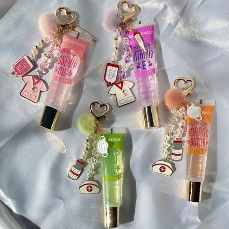 These keychains are a great way to accessorize while keeping lip gloss handy at all times!  * Nursing & healthcare inspired charms * Gold metals with pearl accents Various colors available! Lip Gloss With Charms, Lip Gloss Charms, Keychain Lipgloss, Capri Party, Lip Gloss Keychain, Lipgloss Keychain, Nursing Aesthetic, Charm Necklace Diy, Nursing Fun