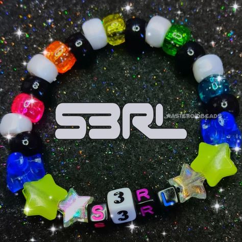 s3rl dj kandi bracelet !!! my favorite dj :3 ♡ handmade with love by me! ♡ freebies with every order! thank you for your support <33 🩷🌸❤️🌸🧡🌸💛🌸💚🌸💙🌸💜 shares are greatly appreciated! you are helping me grow my small business <3 PLUR!! 🫶🌈 #kandi #kandikid #kandicuff #kandibracelet #kidcore #scenecore #dreamcore #pinkcore #kawaii #decora #fairykei #rainbowcore #s3rl #djs3rl Kandi Organization, Band Kandi Bracelets, Band Kandi, Scenecore Kandi, Jewelry Pics, Kandi Inspo, Diy Kandi Bracelets, Diy Kandi, Kandi Kid