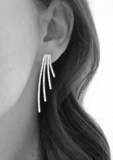 Stunning sterling silver Art Deco earrings, handmade by Verve Jewellery. These beautiful statement earrings have been handmade using sterling silver wire and are inspired by the striking designs of the Art Deco Era. Measuring at approximately 5cm in length and approximately 1.5cm width, these large silver studs have been designed to be worn one ofRead more ⟶ The post Art Deco earrings sterling silver appeared first on The Market Co. Silver Art Deco Pierced Earrings, Silver Art Deco Drop Earrings, Handmade Silver Art Deco Earrings, Art Deco Sterling Silver Drop Earrings, Silver Gemstone Art Deco Earrings, Art Deco Jewellery Design, Silver Statement Earrings, Contemporary Earrings, Deco Earrings