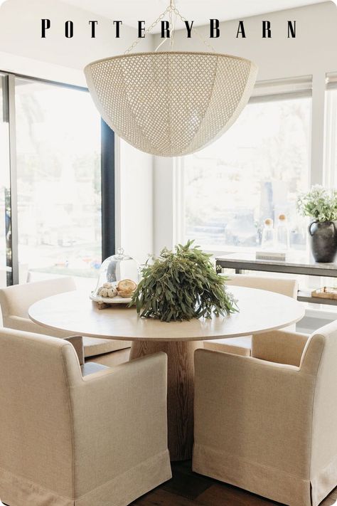 Create a cozy space for gathering by pairing a round table with an eye-catching light fixture and statement chairs. Whether you love a chunky chair or minimalist seating, our Warner Round Pedestal Table complements any dining chair style. #MyPotteryBarn📸: @ hearthstonedesignco Dining Table Light Fixture, Marble Pedestal Dining Table, Marble Bistro Table, Round Pedestal Table, Round Marble Table, Bar Height Dining Table, Kitchen Table Lighting, Dream Dining Room, Nook Table