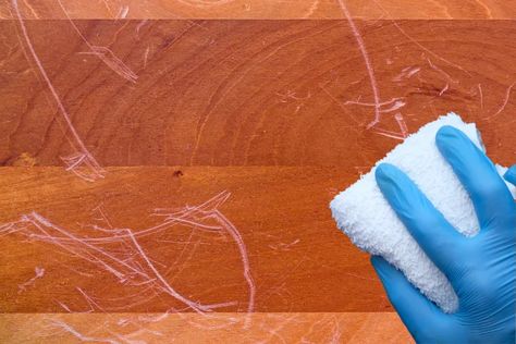 Wood tables are prone to scratches and damage. Here is a list of methods for do-it-yourself fixes and when to use them to get the best results. How To Remove Scratches From Wood Table, Fix Scratches In Wood, Wood Table Protector, Fix Scratched Wood, Chicago Condo, Old Wood Table, Restore Wood, Scratched Wood, Dark Wood Table