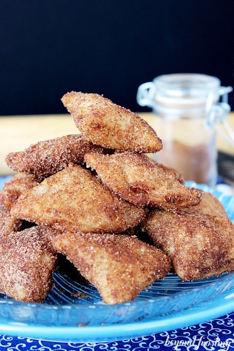 These Deep Fried Apple Pie Bites are so addicting. Pie crust, stuffed with apple pie filling, deep fried and rolled in cinnamon sugar. Fried Apple Pie, Deep Fried Desserts, Fried Apple, Fried Apple Pies, Fried Dessert, Apple Pie Bites, Coconut Dessert, Pie Bites, Deep Fried Food