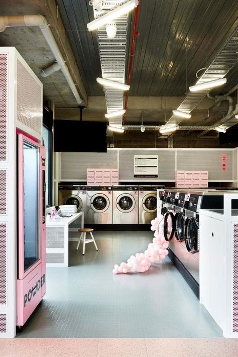 The soft pink palette — which was inspired by the stray red sock that makes it into your load of whites — is matched with a terrazzo floor, perforated metal fittings and minimalist furnishings. Laundromat Design, Laundromat Business, Laundry Business, Coin Laundry, Commercial Laundry, Laundry Mat, Laundry Shop, Laundry Design, Hospital Interior Design