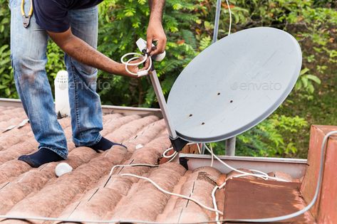 Worker installing satellite dish and antenna on roof top by ThamKC. Skillful worker installing satellite dish and television antenna on roof top#dish, #antenna, #satellite, #Worker Satellite Antenna, Television Antenna, Antenna Tv, Ethereum Mining, Digital Antenna, Garage Door Openers, Flyer Templates Design, Satellite Dish, Social Environment