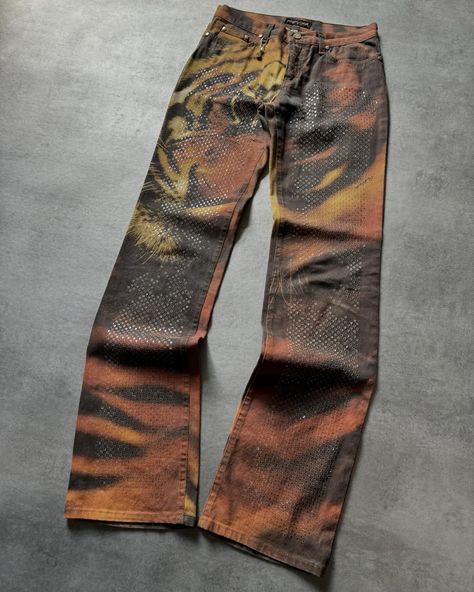 FW2000 Roberto Cavalli Savage Tiger Pants 🦁 Available now on www.dolcevitahub.com | Link in bio Tiger Pants, Denim Washes, Custom Pants, African Clothing For Men, Denim Ideas, Fashion Design Portfolio, Fashion Wishlist, Current Styles, Men Fashion Casual Outfits