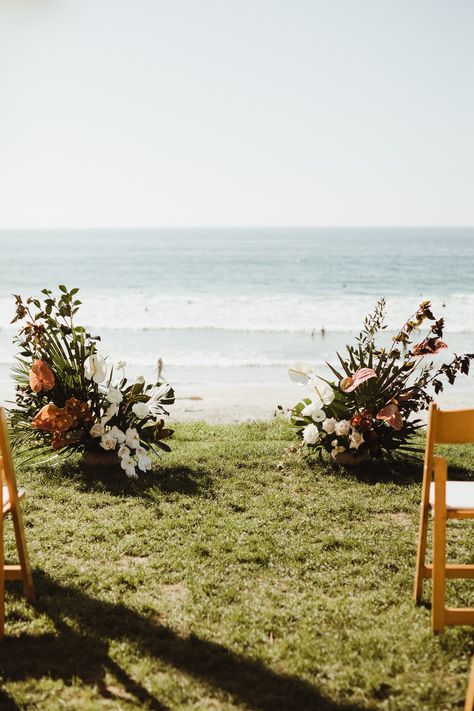 These satellite floral pieces looked amazing at the beach wedding. They didn't take away from the view of the ocean and were the perfect alternative to a traditional arch! See more on our blog! #archalternative #floralpieces #beachwedding Wedding No Arch Ideas, No Arch Ceremony, Arbor Alternatives Wedding Altars, Low Floral Wedding Ceremony, Alternative Arches For Wedding, Beach Wedding No Arch, Alternatives To Wedding Arch, Wedding Arbour Alternative, Alternative Wedding Arch Ideas