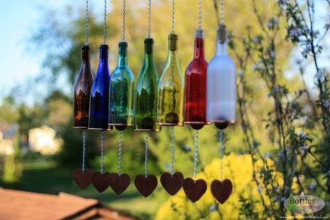 Got some empty glass bottles hanging around the house? You can reimagine this "garbage" into some really stunning, useful crafts for your home. Bottle Wind Chimes, Wine Bottle Bird Feeder, Glass Windchimes, Unique Wine Gifts, Wine Bottle Wind Chimes, Empty Glass Bottles, Empty Wine Bottles, Glass Wind Chimes, Wine Bottle Decor