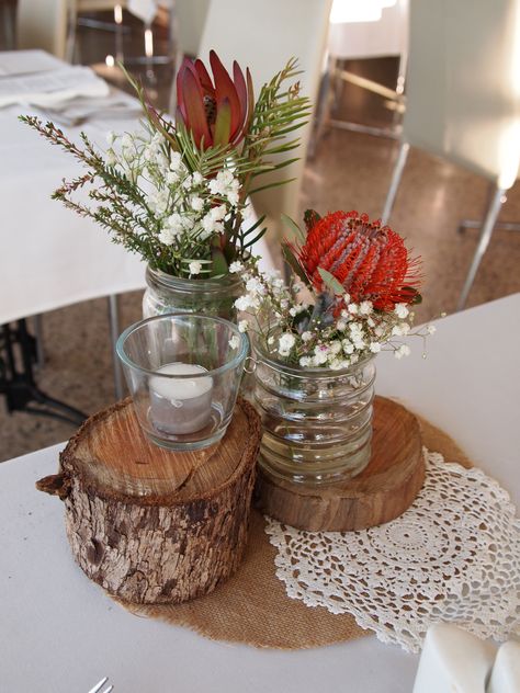 rustic stumps as wedding centrepieces with Australia native flowers Native Table Arrangements, Aboriginal Wedding, Recycled Wedding Decorations, Bush Dance, Sept Wedding, Native Wedding, Recycled Wedding, Flower Table Decorations, Reception Styling