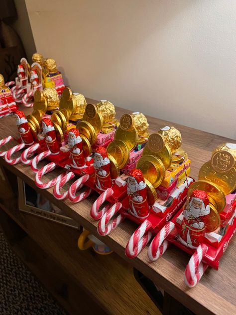 Chocolate and sweetie stacked sleigh Christmas Sleigh Candy, Chocolate Santa Sleigh, Candy Sleds Diy Christmas, Santa Candy Sleigh, Diy Christmas Goodie Bags For Adults, Candy Sleighs For Christmas, Chocolate Sleigh, Santa Sleigh Candy, Christmas Gifts Homemade