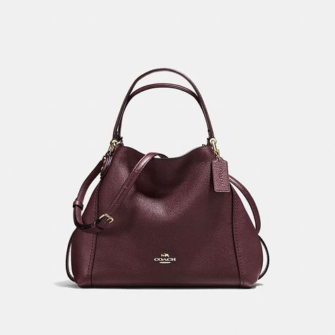 Edie combines downtown ease with utility. Soft and slouchy in polished pebble leather, the 28 is a scaled-down version of the original, with a spacious main compartment that secures with a snap and a dogleash clip. Comfortable handles and an adjustable strap offer multiple ways to wear. Coach Edie Shoulder Bag, Large Hobo Bag, Polished Pebble, Small Shoulder Bags, Coach Handbag, Hobo Bags, Women Bags Fashion, Givency Antigona Bag, Coach Leather