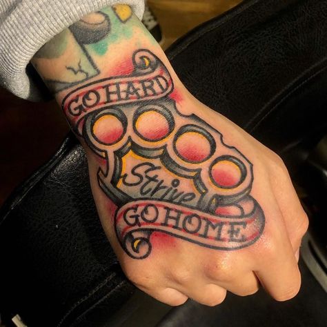 American Traditional Brass Knuckle Tattoo, Traditional Hand Tattoo Men, Traditional Brass Knuckle Tattoo, Strong Man Tattoo, Traditional Word Tattoo, American Traditional Hand Tattoos, Foot Tattoos For Men, Old Traditional Tattoo, Brass Knuckle Tattoo