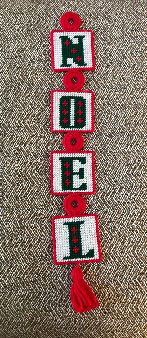 "These are great on a tree, wreath or hanging on a door. Granny retro!  A vintage handmade wall hanging that spells NOEL. It is plastic canvas squares with completed needlepoint. Each square has a green letter on a white background with a red border There is a needlepoint \"tassel\" at the end and a needlepoint hook for hanging. The back of each square is covered with white felt material.  The entire piece is 20 inches long and it is 3 inches wide.  This item is in very good condition, no loose Plastic Canvas Noel Wall Hanging, Plastic Canvas Stocking Patterns, Christmas Plastic Canvas Patterns Free, Plastic Canvas Christmas Patterns, Plastic Canvas Wreath, Needlepoint Tree, Plastic Canvas Letters, Needlepoint Christmas Ornaments, Christmas Squares