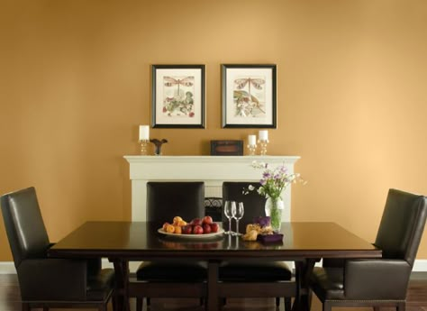 November calls to mind the scent of autumn leaves, a smile outdoors on a sunny day and the excitement of the upcoming holiday season. That’s why Gold Hearted T17-02 is the ideal choice – by name and tint – for our Color of the Month. This soft gold tone evokes a sense of comforting warmth even on the coolest … Gold Painted Accent Wall, Gold Paint Behr, Gold Hearted Behr Paint, Behr Gold Hearted, Gold Tone Wall Paint, Gold Color Paint For Walls, Amber Autumn Behr Paint, Gold Painted Walls Living Room, Gold Interior Paint Colors