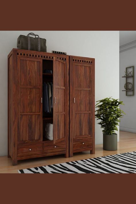 Traditional style wooden three door almirah for home with 3 Drawers & Multiple Utility Storage | Colour: Honey Finish | Mounting Type: Floor Mount | Primary Material: Sheesham Wood | Secondary Material: Solid MDF/Plywood Depending On Availability | Give Your Home A Luxurious Look With Sheesham Wooden Wardrobe For Bedroom | #Sponsored Bedroom Almirah, Wardrobe For Bedroom, Clothes Cupboard, Wood Cupboard, Almirah Designs, 3 Door Wardrobe, Wood Wardrobe, Living Room Door, Shelves Storage