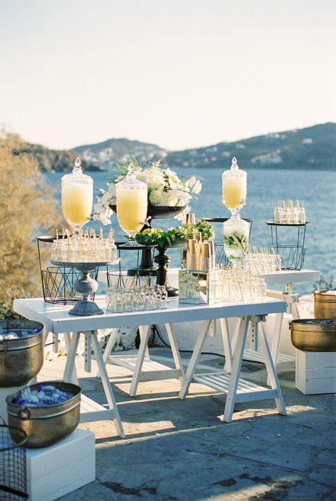 The Best Ways to Keep Guests Hydrated at Your Wedding Mykonos Themed Party, Greek Wedding Food, Lime Infused Water, Greece Party, Lemonade Bar, Wedding Drink Station, Mason Jar With Straw, Mykonos Wedding, Wedding Food Drink