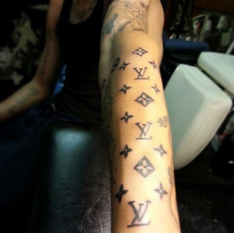 Fashion Tattoo Inspiration | POPSUGAR Fashion Lv Hand Tattoo, Lv Tattoo Design, Gucci Tattoo Ideas, Louis Vuitton Tattoo Ideas, Dior Tattoo, Jeffree Star Tattoos, Lv Tattoo, Chanel Tattoo, Ryan Tattoo