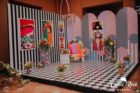 The monochrome print really brought out the vintage Pop Art prints for this Bride seating! Colourful and quirky through floral, furniture, prints and other accents adding character. Don't miss the colourful pom pom Chandelier! #popart #popartdecor #popartstage #popartmehendidecor #popartbridalseating #colourfuldecor #quirkydecor #colourfulchandelier #funcolourfuldecor #funcolourfulmehendidecor #popartpictureframes #popartpaintings #indianwedding #destinationwedding #goaweddings #weddingsingoa Pop Art Centerpiece, Pop Art Wedding Decor, Pop Art Party Decoration, Wood Backdrop Wedding, Pop Art Furniture, Pop Art Wedding, Pop Art Exhibition, Pop Art Party, Pop Art Prints