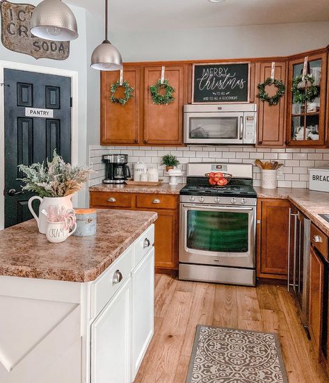 Lara | Peonies + Twine on Instagram: “Nothing fancy here!  Just our cozy little kitchen decked out for Christmas! I added these mini wreaths from @michaelsstores today but I…” Light And Bright Kitchen, Christmas Kitchens, Brown Kitchen Cabinets, Kitchen Confidential, Bright Kitchen, Brown Cabinets, Kitchen Christmas, Dark Kitchen, Brown Kitchens