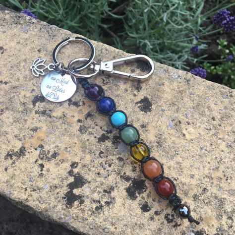 A beautiful keychain/ bag charm. This is handmade using 1mm waxed cotton cord and 8mm beads. Using a 25mm split ring and clasp. This comes with a pretty stainless steel disc which says ‘ no mud no lotus’ and with a steel lotus. A lovely gift to give or receive. The meaning of each chakra: Crown Chakra - Amethyst- Purple - The highest chakra, our spiritual center: enlightenment, unity Third Eye Chakra - Lapis lazuli- Indigo - Perception center: wisdom, consciousness, intuition, power of No Mud No Lotus, Spiritual Center, Keychain Purse, 8mm Beads, Writing Gifts, Keychain Bag, Chakra Balancing, Third Eye Chakra, Amethyst Purple