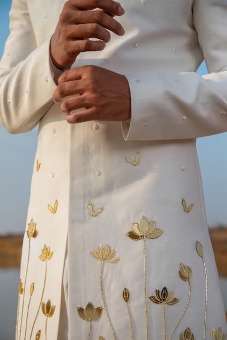 Buy Ivory Sherwani Chanderi Silk Bloom Applique Embellished And Kurta Set For Men by Runit Gupta Online at Aza Fashions. Hand Work Motifs, Mens Hand Painted Kurta, Mens Embroidered Kurta, Men Carnival Outfit, Kurta Work Designs For Men, Men Kurta Embroidery Design, Hand Painted Kurta For Men, Mens Kurta Embroidery Designs, Haldi Outfit For Men