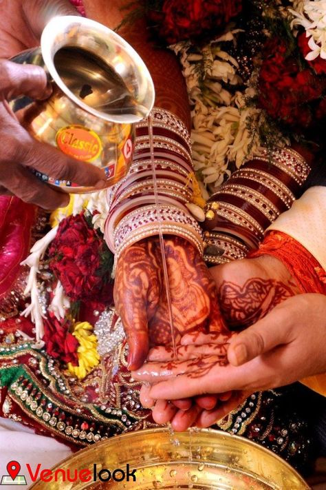 The most important and sentimental ritual of the wedding ceremony is Kanyadaan. From the age-old, it is believed that the bride is given by the parents to the groom, as daan and according, to the Vedic traditions Kanyadaan is considered as the biggest achievement. Father of the bride, requests the groom through Vedic mantras to take care of his daughter and the groom accepts the bride’s hand promising to treat her as his utmost love. Kanyadaan Photography, Sindoor Moment, Indian Wedding Pictures, Punjabi Weddings, Wedding Photography Bridal Party, Wedding Photography Checklist, Indian Wedding Poses, Marriage Photography, Indian Wedding Photography Couples