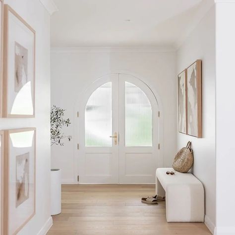 Coastal Inspiration 🤍 Imagine walking through these beautiful arched doors to be welcomed into your beautiful, calm, tranquil home that's feels luxury and modern, filled with plenty of natural lighting. Let's make your dream home a reality! #interiordecoratinggeelong  #surfcoastinteriordesigner  #residentailinteriordesigner  #bedroominteriors   #interiorstyling    #furnitureprocurement  #interiorsdesignservices  #furnitureselections   #homeinteriordesigner   #interiordecoarting  ... Curved Entryway, Modern Entryway Decor, Coastal Inspiration, Modern Entryway, Arched Doors, Door Lever, Contemporary Minimalist, White Room, Natural Lighting