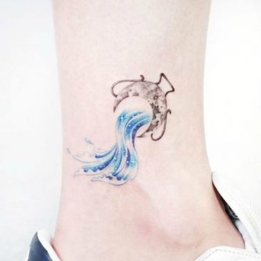 25 Best Aquarius Tattoo Ideas And Zodiac Sign Tattoos With Meanings | YourTango Zodiac Constellation Tattoos, Aquarius Symbol Tattoo, Aquarius Tattoos, Tatuaje Studio Ghibli, Aquarius Constellation Tattoo, Aquarius Symbol, Phönix Tattoo, Astrology Tattoo, Horoscope Tattoos