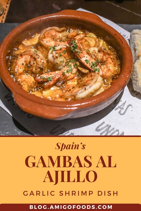 The origins of the Spanish tapa, Gambas al Ajillo, aren’t exactly clear. Some claims trace it back to Al Ajillo, which is a famous meal in all Spanish-speaking countries. They started cooking it in Mexico using garlic and guajillo chili peppers. It’s believed that the Spanish folks wanted to create their own version of the plate, thus the use of shrimps. #spanishfood #spain #tapas #shrimp #amigofoods #recipes Shrimp In Garlic Sauce Spanish, Shrimp Al Ajillo, Shrimp Ajillo Recipe, Spanish Shrimp Tapas, Spot Shrimp Recipes, Shrimp Tapas Recipes, Spanish Seafood Recipes, Spanish Shrimp Recipes, Shrimp Gambas Recipe