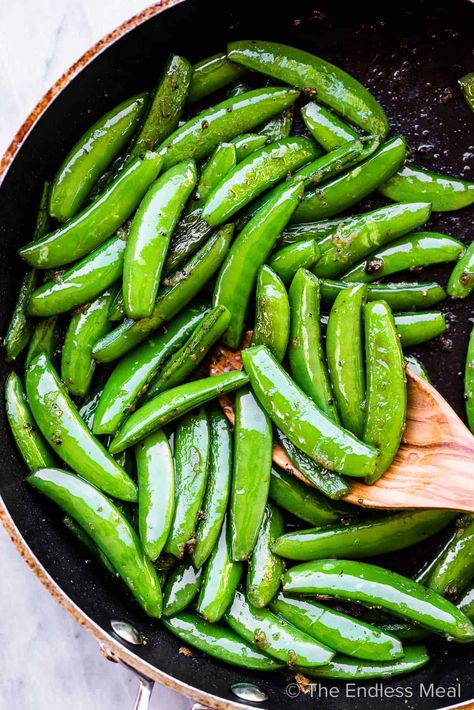 PIN TO SAVE FOR LATER! Garlic butter sugar snap peas is a super simple, 5-minute side dish that goes well with nearly every main course dinner. You'll love it! #theendlessmeal #sugarsnappeas #snappeas #snappeasrecipe #sugarsnappeasrecipes #sidedish #garlicbutter #easysidedish #fastsidedish #quicksidedish #vegetarian #paleo #healthy #healthyrecipes #sugarfree Cooking Sugar Snap Peas, Snap Pea Recipe, Sugar Snap Peas Recipe, Caprese Sandwich Recipe, Side Dish Vegetable, Sugar Snap Pea Recipe, Snap Peas Recipe, Sugar Snap Pea, Weeknight Meal Ideas