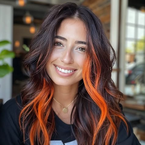 Black And Color Highlights, Dark Hair Orange Money Piece, Black And Orange Highlights, Dark And Orange Hair, Halo Vivid Hair Color, Orange Money Piece Hair Brunette, Dimensional Vivid Hair, Brown And Vivid Hair, Subtle Peekaboo Hair Color Brunettes