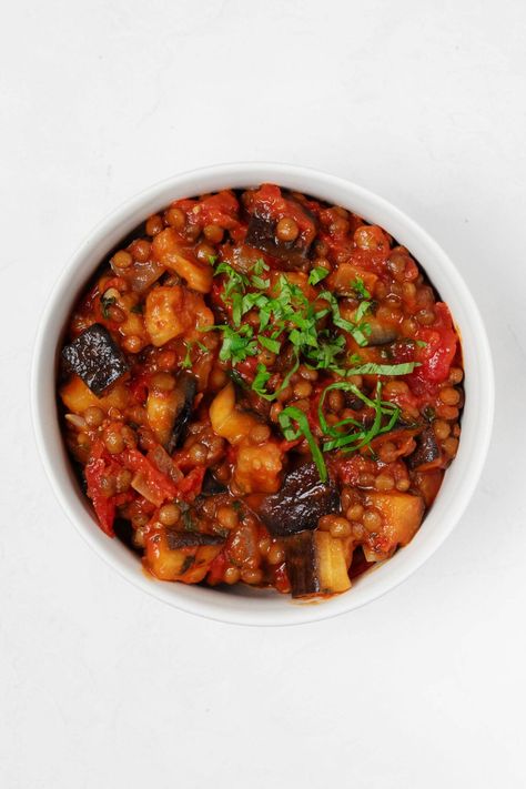 These easy vegan stewed eggplant tomato lentils are saucy, savory, and super versatile. You can dip warm wedges of pita into them, serve them over pasta or a grain, or use them as a bruschetta topping. This is a great starter recipe for those who enjoy eggplant, but aren't accustomed to cooking it. Eggplant And Lentils Recipe, Stewed Eggplant, Vegetable Tikka Masala, Vegan Eggplant Recipes, Tomato Eggplant, Tomato Lentils, Lentils Vegan, Eggplant Caponata, Slow Cooker Black Beans