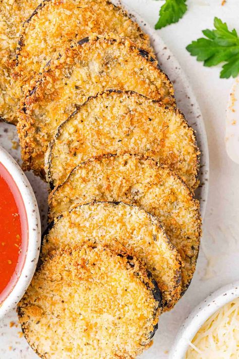 Crispy panko-coated air fryer eggplant can be the starting point of eggplant Parmesan, a flavorful vegetarian main dish, or a delicious side—it’s your call! Any way you serve it, this easy recipe gives under-appreciated eggplant a chance to shine. Crispy Eggplant Parmesan, Eggplant Recipes Air Fryer, Air Fryer Eggplant, Air Fryer Eggplant Parmesan, Eggplant Parmesan Air Fryer, Eggplant Parm In Air Fryer, Airfryer Eggplant Parmesan, Eggplant Parmesan Air Fryer Recipe, No Fry Eggplant Parmesan