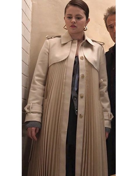 “Only Murders in the Building” debuted on August 31, 2021, and has since delivered three successful seasons.Selena Gomez. Selena Gomez portrays Mabel Mora.She looks elegant in this Only Murders In The Building S04 Selena Gomez Pleated Trench Coat. Attention, ladies! Don’t miss your chance to own this chic pleated trench coat. Grab yours now before it’s gone! Only Murders In The Building, White Trench Coat, Fringe Coats, Selena Gomez Outfits, Beige Trench Coat, Costume Outfits, The Building, Pleated Mini Skirt, Season 4