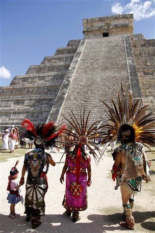 Mayan gather in front of the Kukulkan Pyramid in Chichen Itza, Mexico, Thursday, Dec. 20, 2012. A Mexican Indian seer who calls himself Ac Tah, and who has traveled around Mexico erecting small pyramids he calls "neurological circuits," said he holds high hopes for Dec. 21. "We are preparing ourselves to receive a huge magnetic field straight from the center of the galaxy," he said. Chichen Itza Mexico, Mayan Culture, Mayan Ruins, Mexican Culture, Ancient Ruins, World Cultures, People Of The World, Chichen Itza, Mexico Travel