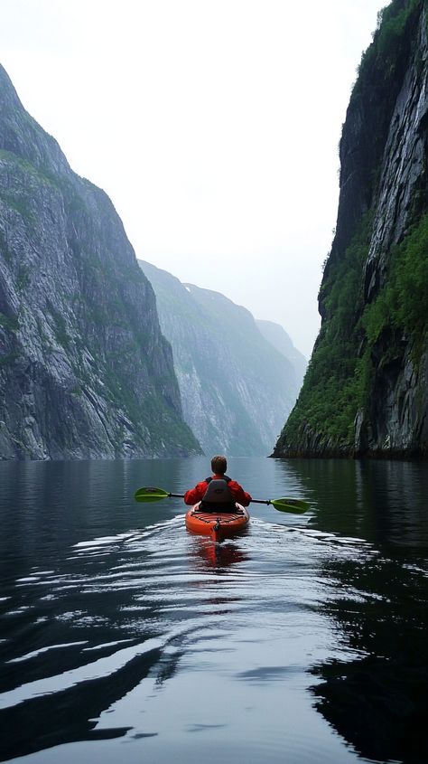 Aries kayaks through Norway's majestic fjords, navigating steep cliffs and calm waters, embracing adventure in a breathtaking landscape. Astro Travel, Fjords Norway, Norway Fjords, Kayak Adventures, Calm Waters, Dream Travel Destinations, Calm Water, Kayaks, Dream Board