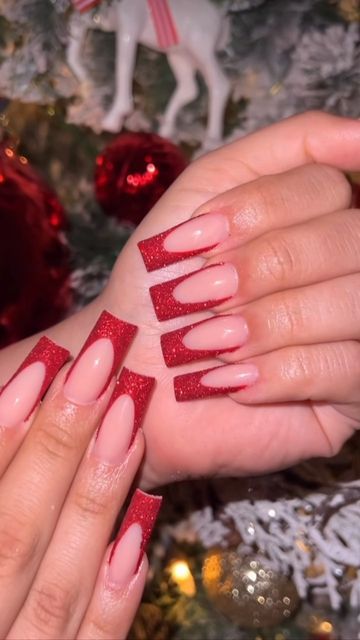 French Tip For Christmas, Red Nail Designs Sparkly, Red French Tip Nails With Silver Line, Dark Red Glitter French Tip Nails, Christmas Acrylic Nails Holiday Long, Red French Tip With Initial, Red Glitter French Tip Nails Christmas, Red Glitter Nails French Tip, Red Glitter French Tip Nails Square