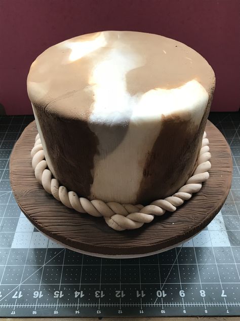 Fondant cow hide effect on cake Yellowstone Birthday Cake, Western Smash Cake 1st Birthdays, Smash Cake Rodeo, Yellowstone Cake, Western Cake Smash, Cow Smash Cake Boys, Cowhide Cake, Brown Cow Print Cake, Rodeo Smash Cake Boys