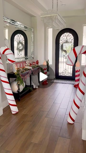 Modern Farmhouse Glam | Amy Long on Instagram: "Comment CHRISTMAS for links or shop the link in my bio! 
Make sure you’re following me @modernfarmhouseglam so the links will come straight to your inbox! ✨

Welcome to Candy Cane Lane!🤍❤️ Transform your entryway into a festive wonderland with peppermint stripes, pops of red, and a sprinkle of Christmas magic! 

#HolidayHomeDecor #ChristmasDecor #HolidayEntryway #amazonfinds #amazonhome 

https://liketk.it/4WRbX" Candy Cane Walkway, Modern Farmhouse Glam, Holiday Entryway, Christmas Entryway, Candy Cane Lane, Farmhouse Glam, Flocked Trees, Prelit Tree, Christmas Front Porch