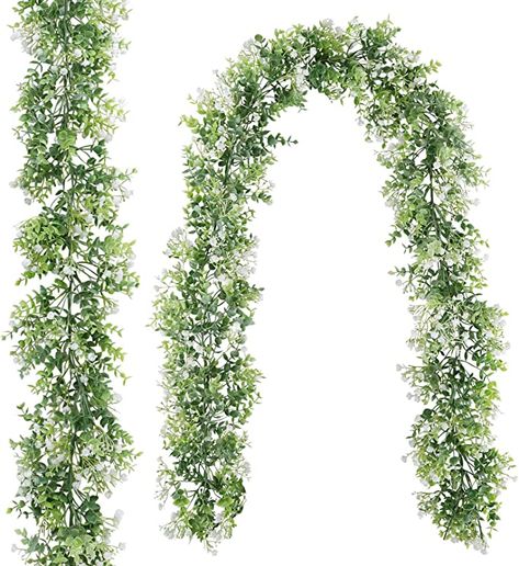 Amazon.com: CEWOR 2 Pack 5.7ft Artificial Eucalyptus Garland with White Flowers Faux Hanging Plants Greenery Vines for Wedding Table Wall Party Home Backdrop Decor: Kitchen & Dining Arched Wall Decor, Artificial Eucalyptus Garland, Pre Lit Garland, Eucalyptus Garland, Artificial Boxwood, Green Garland, Hanging Garland, Artificial Succulents, Greenery Garland