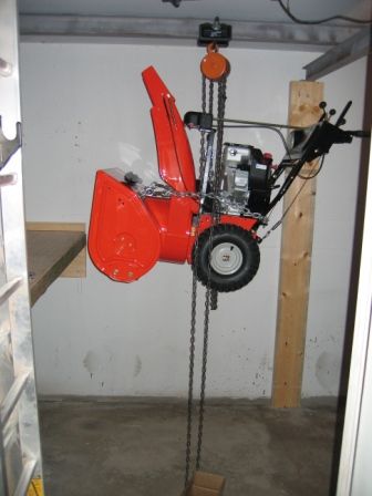 Snowblower Storage In Garage, Snow Blower Storage Ideas, Snowblower Storage, Lawn Equipment Storage, Blower Storage, Diy Overhead Garage Storage, Ariens Snowblower, Snow Equipment, Garage Lift