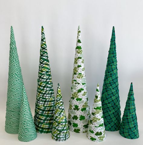 Add some elegance to your holiday display with a gorgeous cone trees. These are handmade fabric wrapped paper mache cone forms. There are 4 different fabric options in 4 sizes. Make your selection from the menu. Cones Dimensions: 12" H x 4" Base, 15" H x 4.5" Base, 18"H x 5" Base and 24" H x 6" Base All trees are sold individually - Photos are for examples of styling Christmas Tree Yarn, Christmas Pom Pom Crafts, Easy Holiday Decorations, Paper Mache Cone, Different Christmas Trees, Shamrock Craft, Christmas Table Decorations Diy, St Patricks Decorations, Paper Mache Christmas